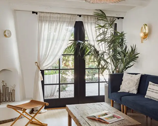 relaxing waiting room with bright windows and comfortable couch